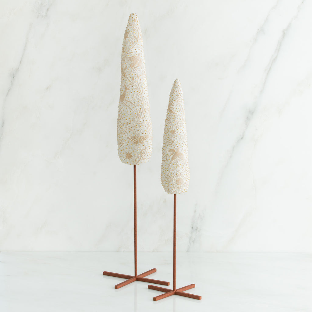Set of two white tree figurines with wooden stands - all white background